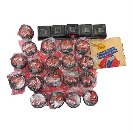 Assortment Of Vintage Canadian Hockey Pucks With Puck Stands